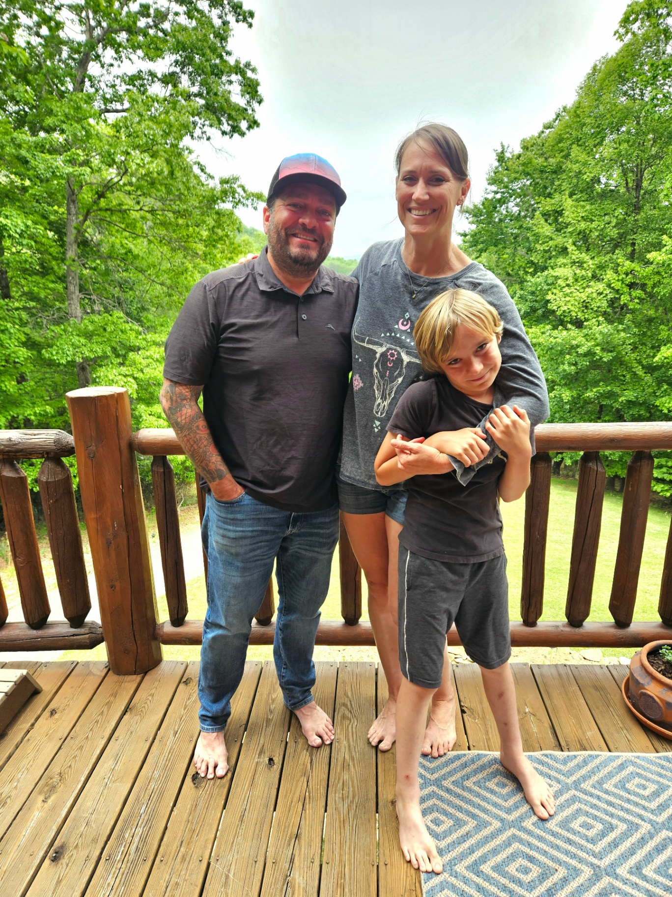 Vaughan, Angela, and Bassil on the porch in the Asheville mountains